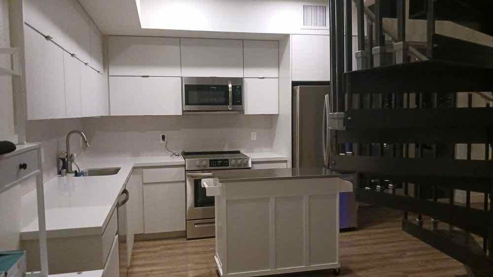 An empty kitchen cleaned out and wiped down ready for handover